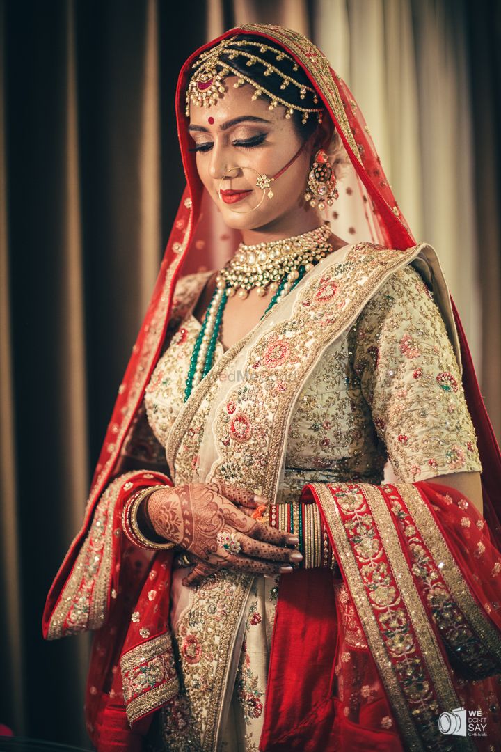 Photo of Offbeat bride with green and red lehenga