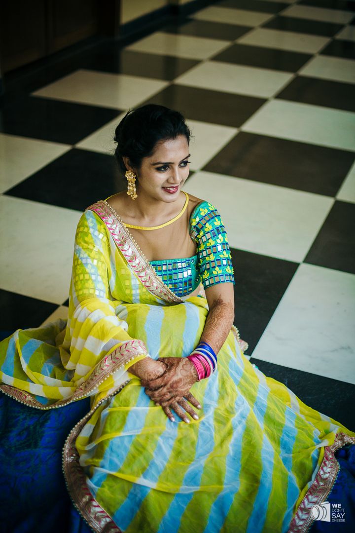 Photo of Yellow and blue lehenga with mirror work blouse