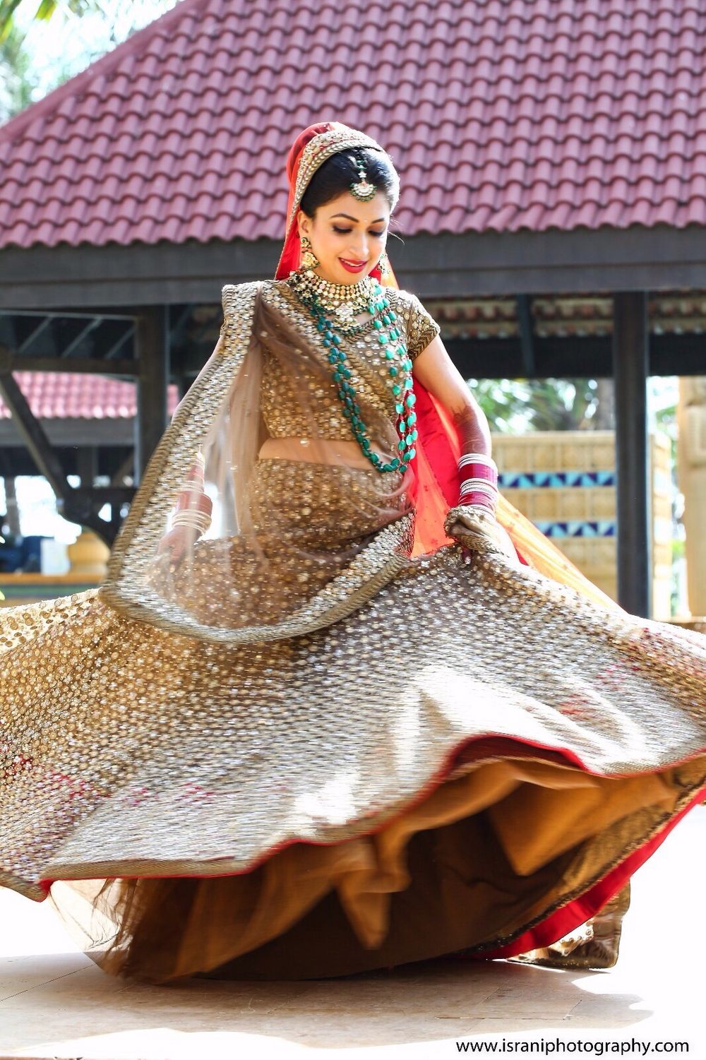 Photo of Twirling Bride in Copper Lehenga