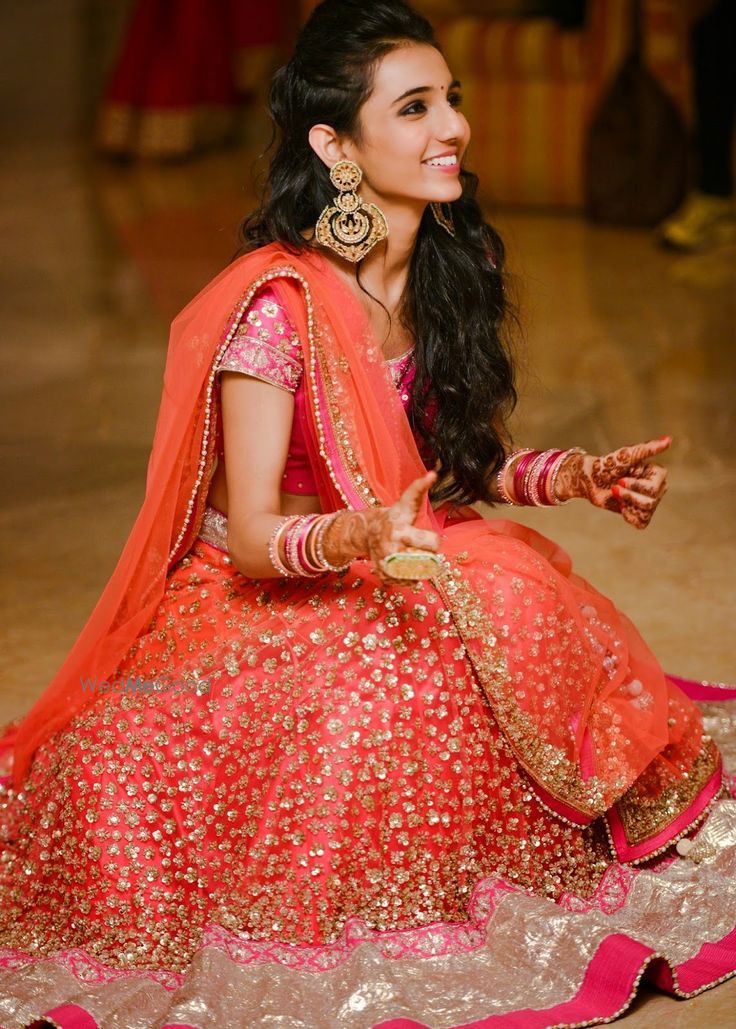 Photo of Orange Glitter Lehenga and Gold Chandbalas