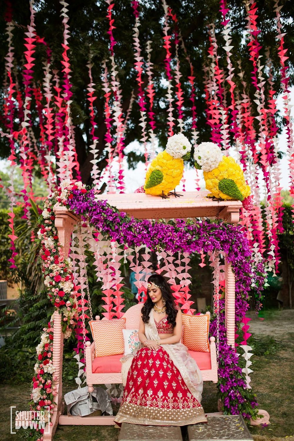 Photo of Quirky mehendi decor with floral birds