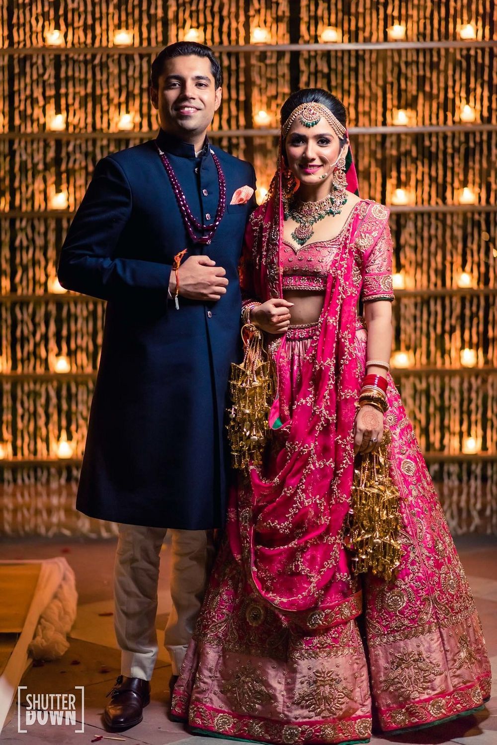 Photo of Contrasting bride and groom outfits with both in different colours