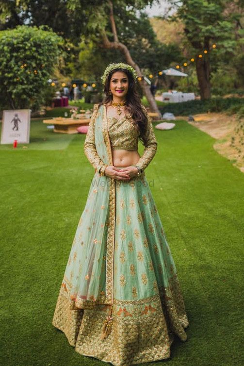 Photo of Engagement lehenga for bride in light blue and dull gold