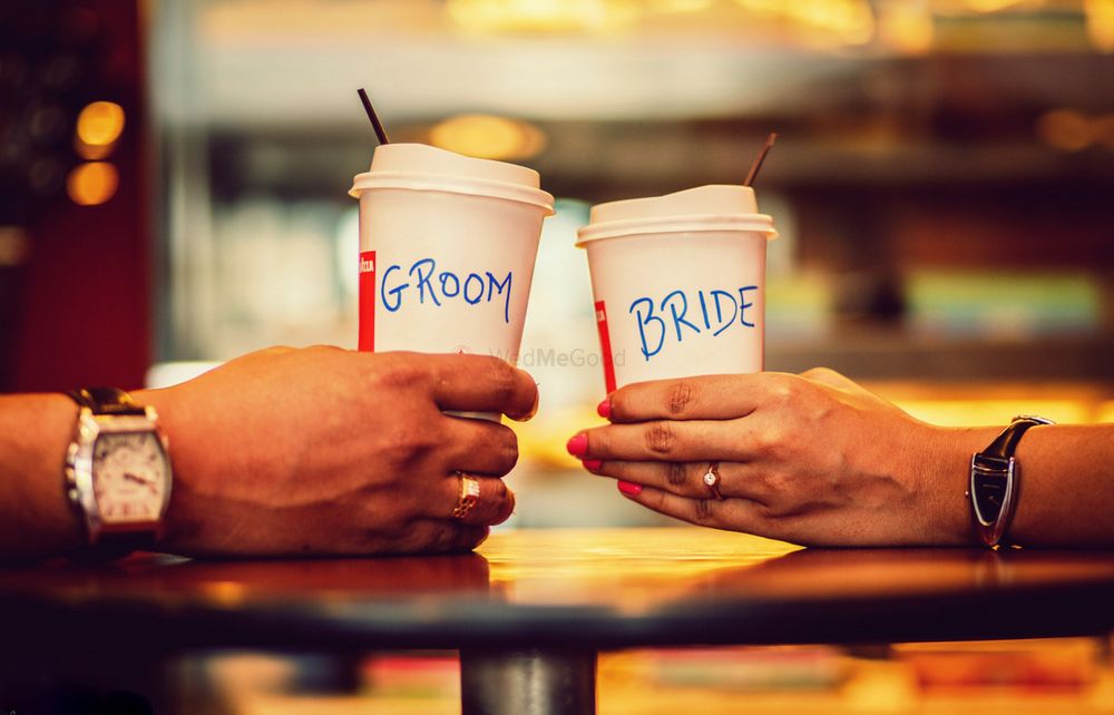 Photo of Bride and groom cups pre wedding shoot