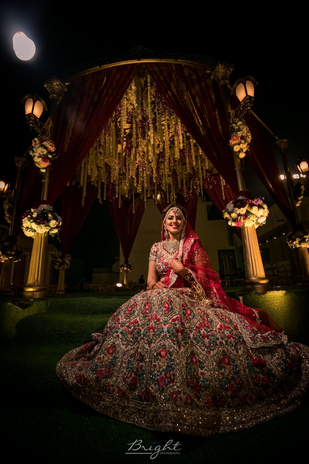 Photo of Offbeat bridal lehenga in red with floral embroidery