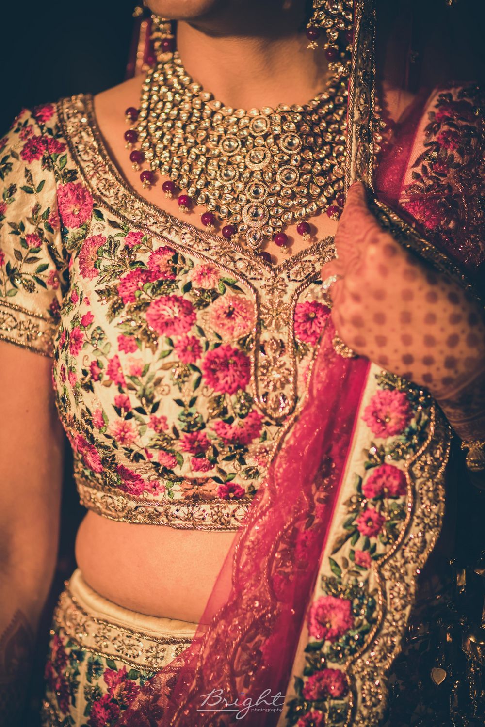 Photo of Elaborate bridal jewellery with floral embroidery lehenga