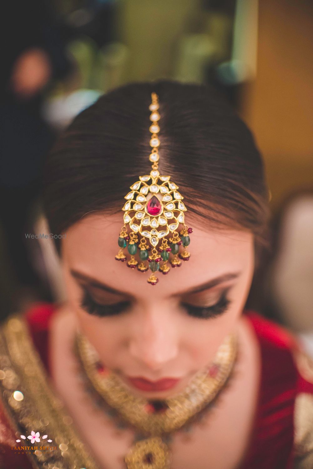 Photo of Stunning kundan and diamond maangtikka with mini emeralds hanging