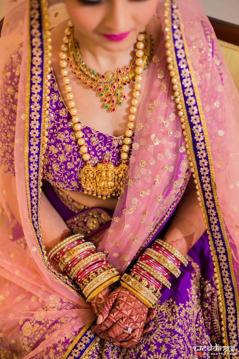 Photo of Offbeat bridal lehenga with temple jewellery