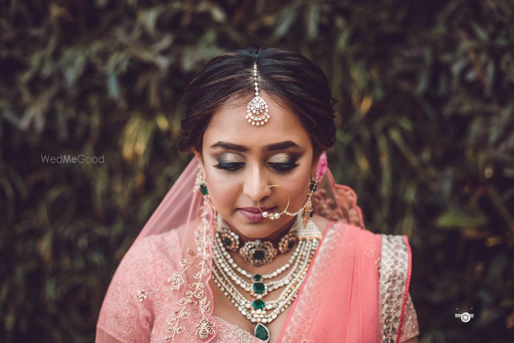 Photo of Layered bridal necklaces with emeralds and diamonds