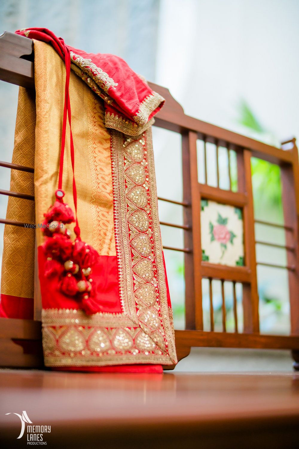 Photo of Gold and Red Saree with Red Latkans