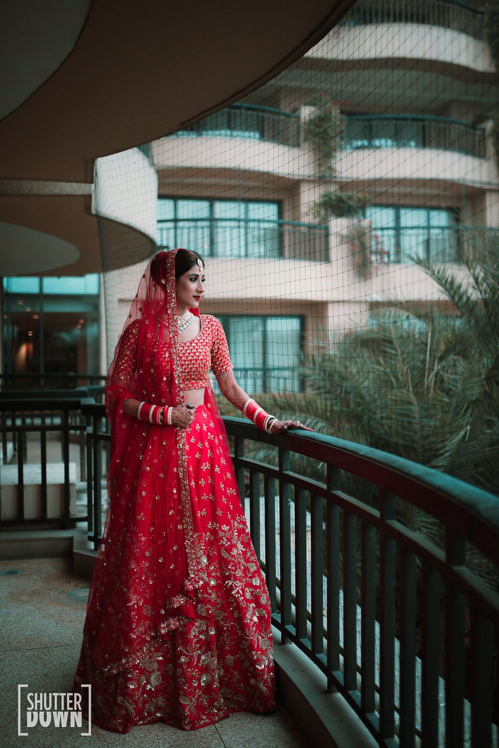 Photo of Red and gold modern bridal lehenga