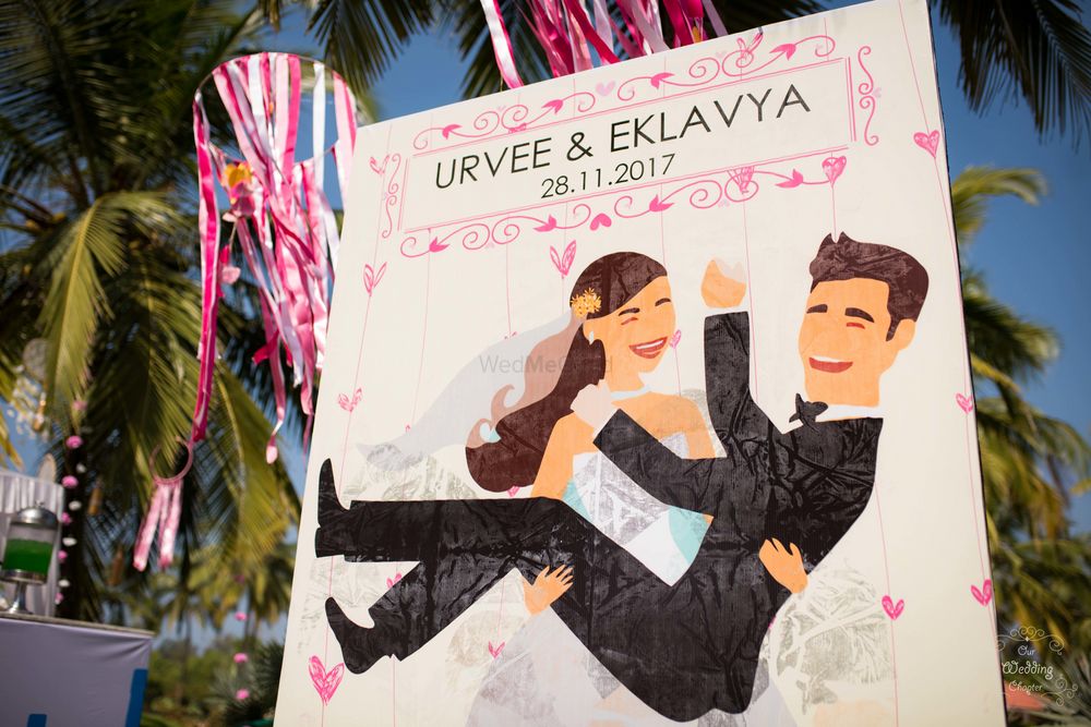 Photo of Bride and groom caricature entrance decor
