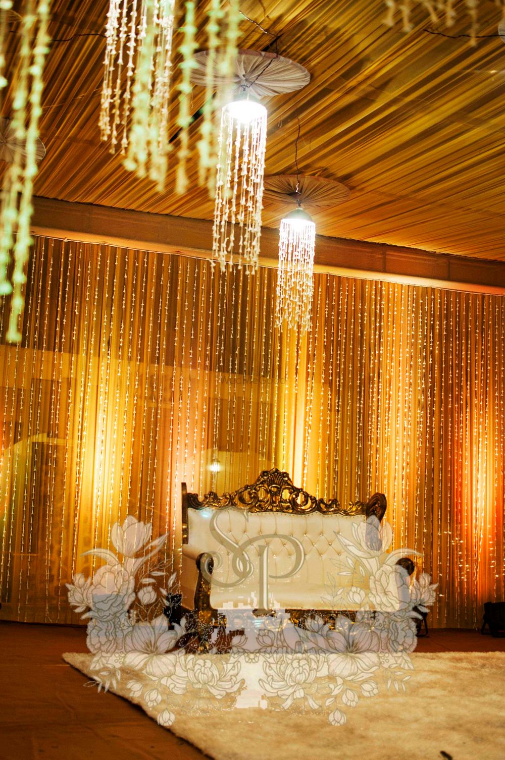 Photo of gold and white stage decor