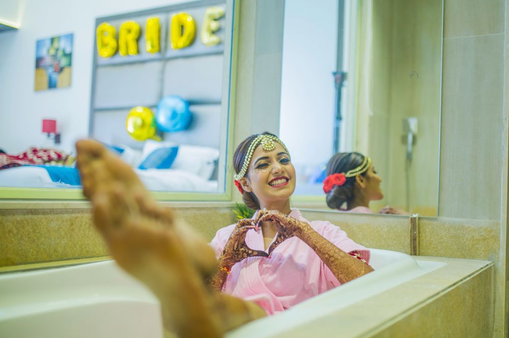 Photo of Bride in bathtub getting ready photo idea