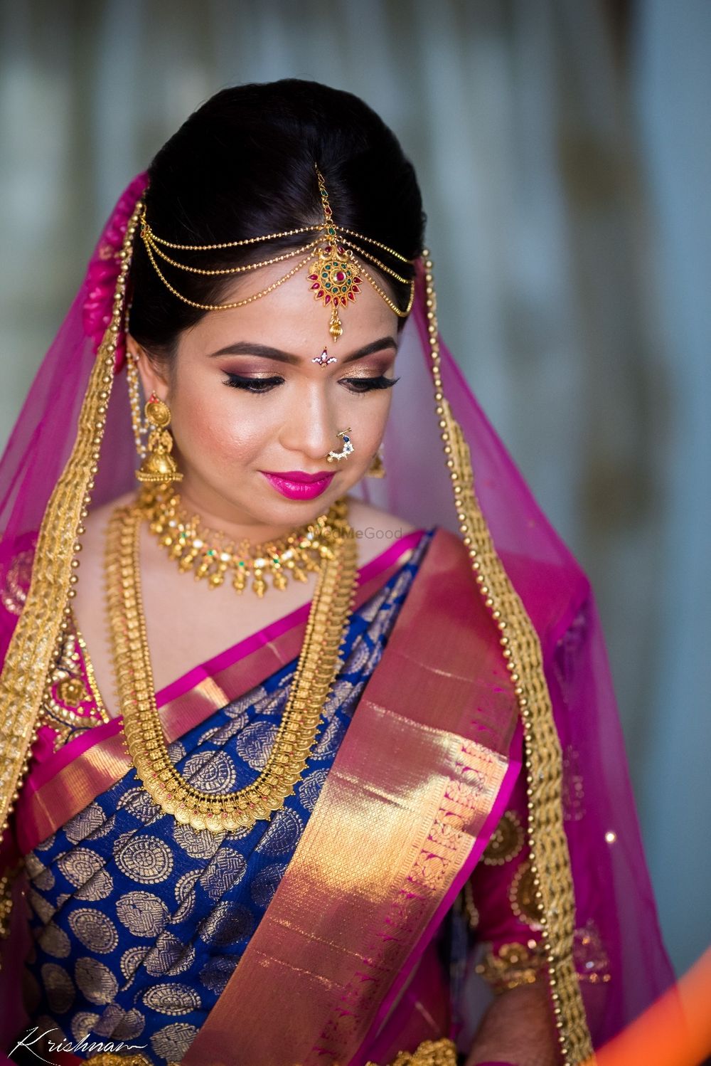 Photo of South Indian bride in contrasting combination kanjiavaram and dupatta