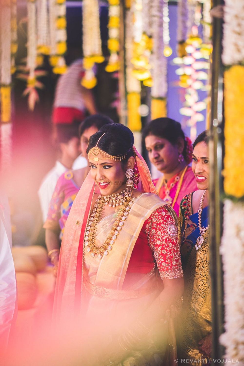 Photo of South Indian bride entering in gold saree and red blouse