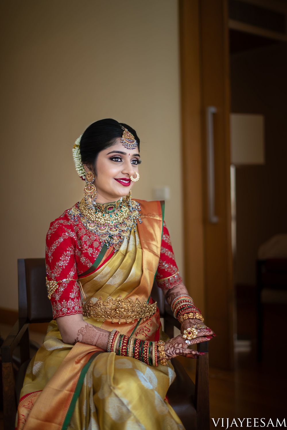 Photo of Red and gold bridal kanjivaram and nath