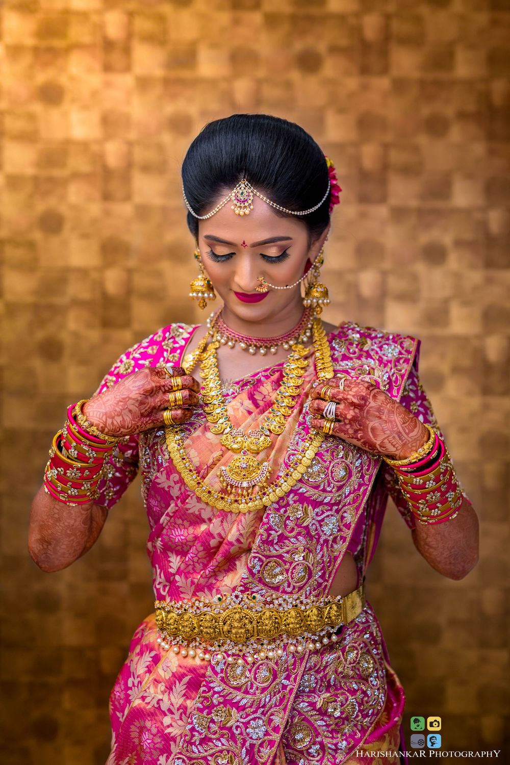 Photo of South Indian bride in embroidered saree and temple jewellery