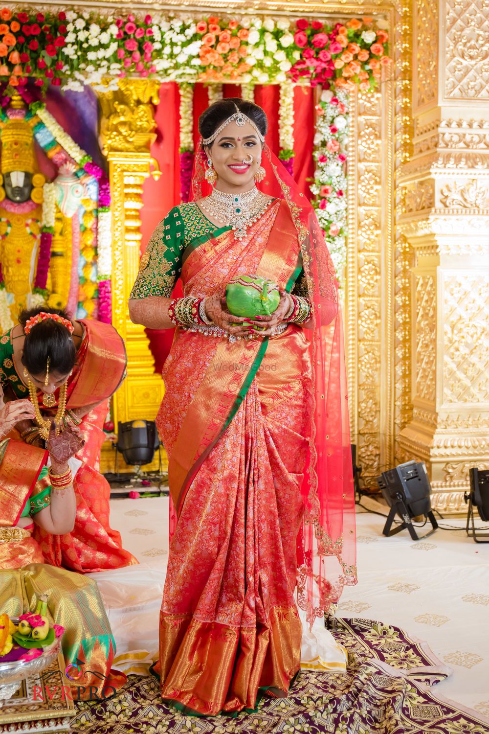 Photo of Bride in orange kanjivaram saree with green blouse