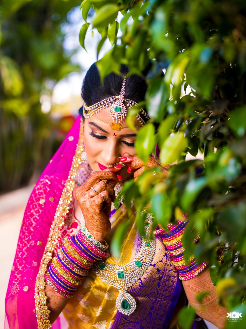 Photo of South indian bridal portrait adjusting nosering