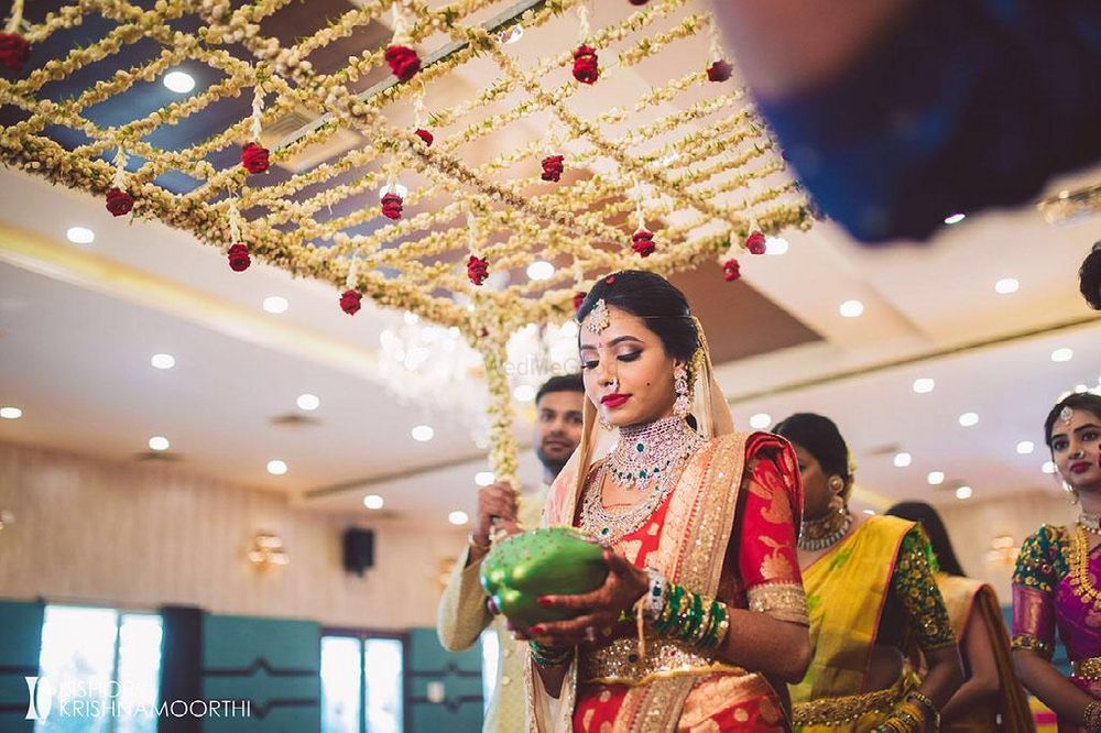 Photo of south indian bridal entry under phoolon ka chadar