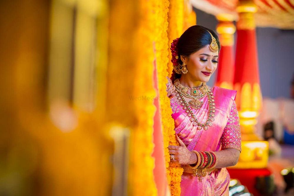 Photo of south indian bridal look in light pink saree and layered jewellery