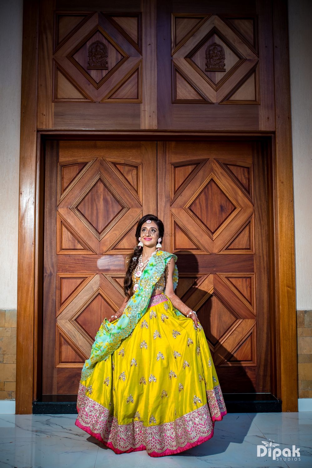 Photo of Beautiful yellow and pink lehenga with floral printed dupatta