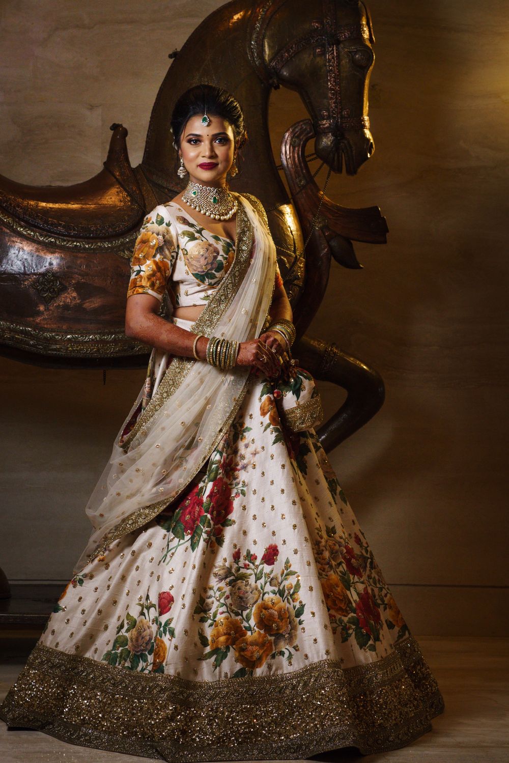 Photo of White reception lehenga with floral work by Sabyasachi