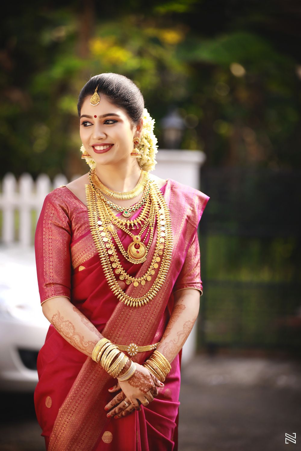 Photo of South indian pink saree with traditional south indian gold jewellery