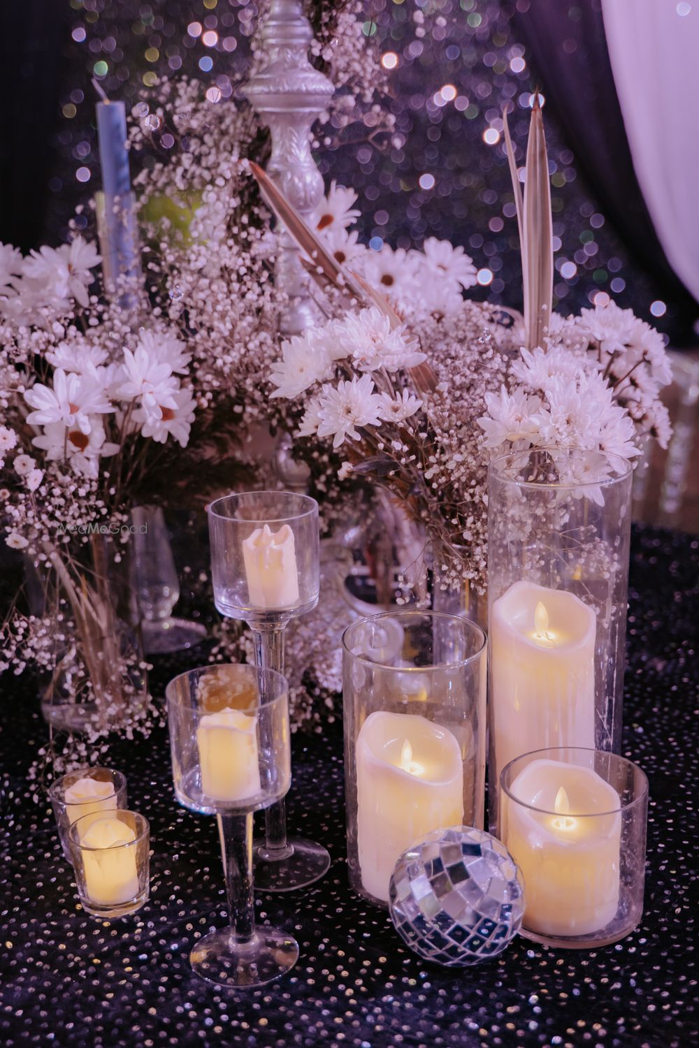 Photo of Lovely table setting with white candles and matching white floral decor