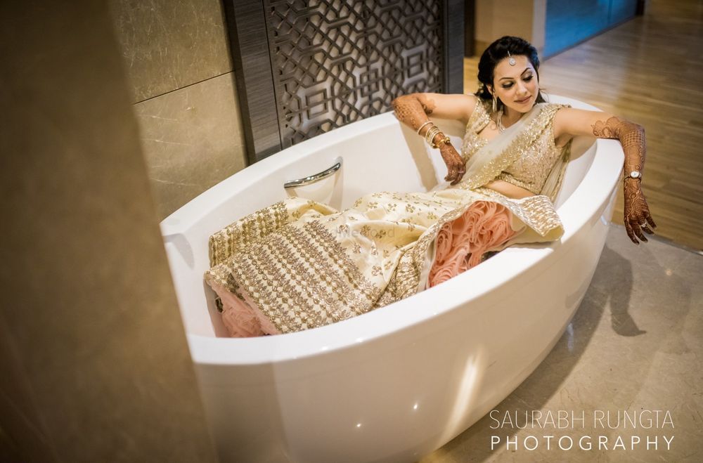Photo of Bride chilling in bathtub before engagement