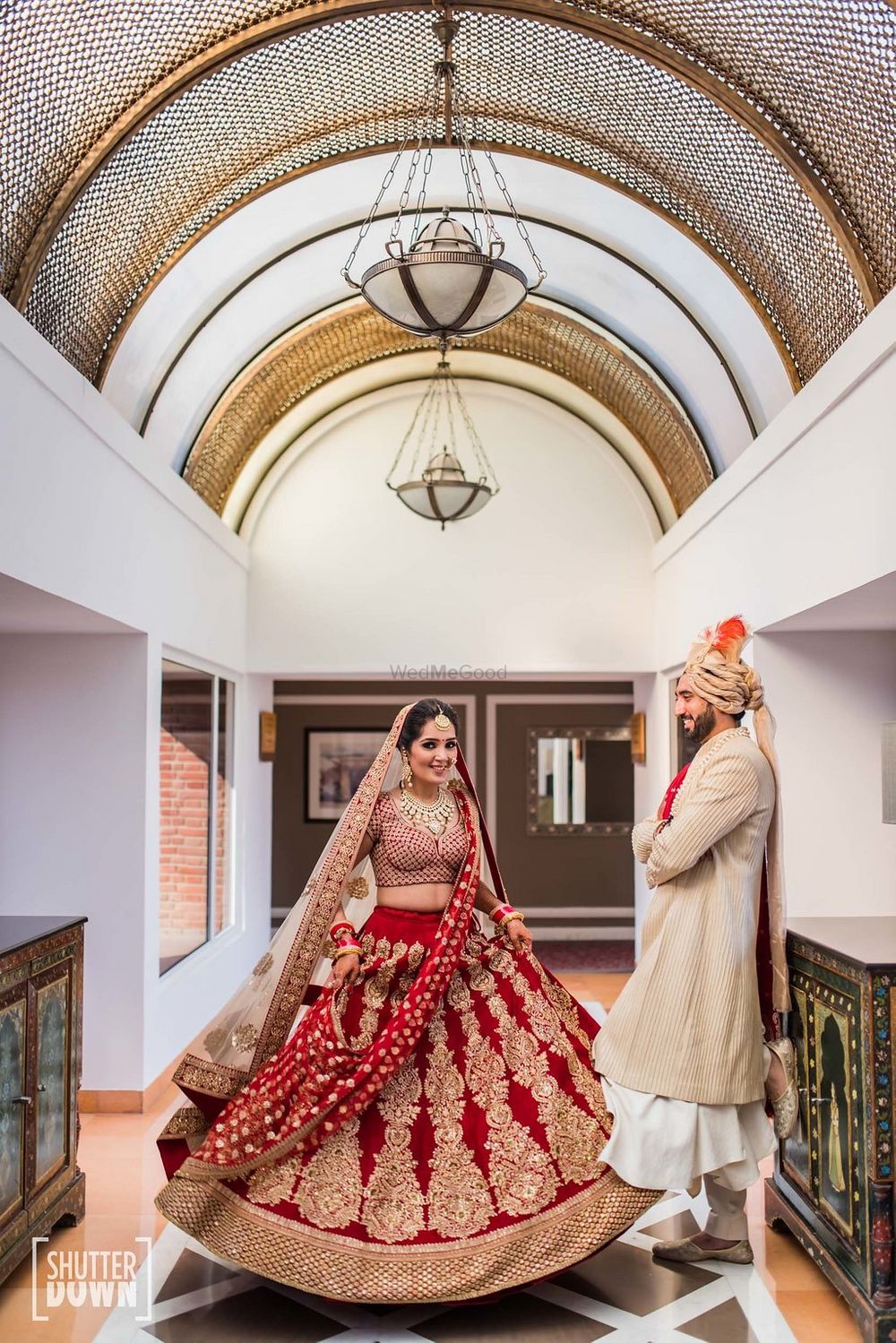 Photo of Beautiful bridal shot in red and gold lehenga