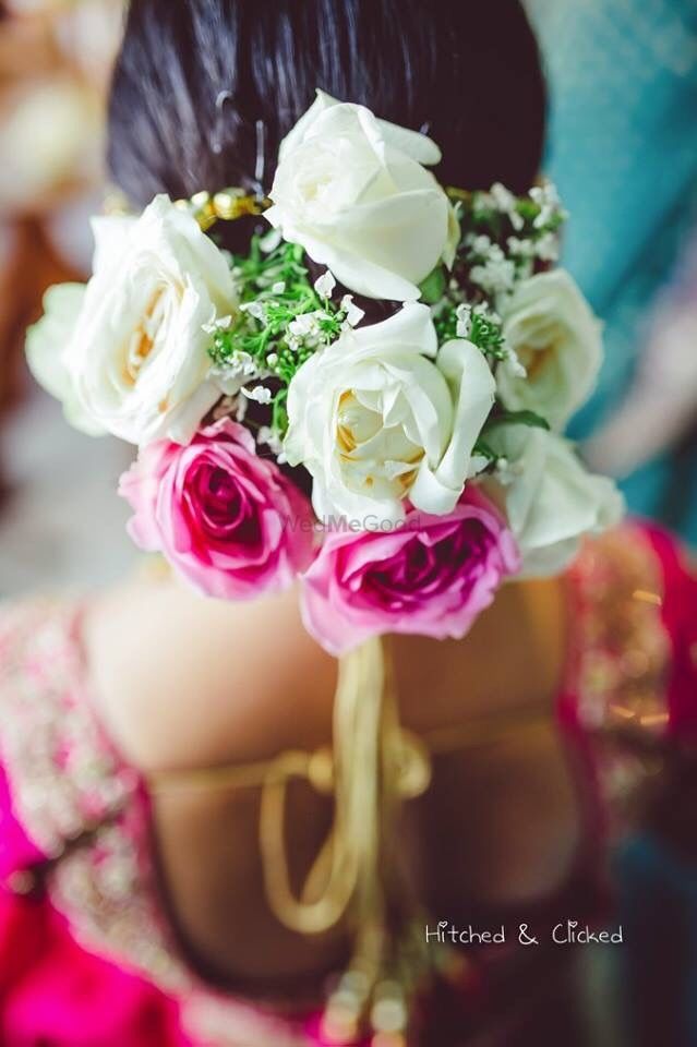 Photo of Pink and white bridal bun with roses