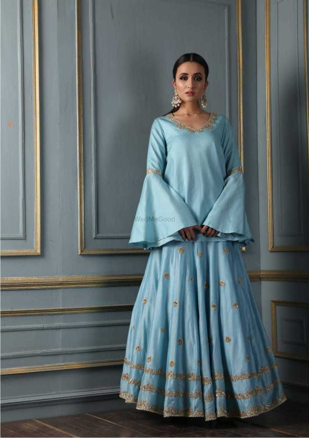 Photo of Simple light blue lehenga with bell sleeves for roka or sister