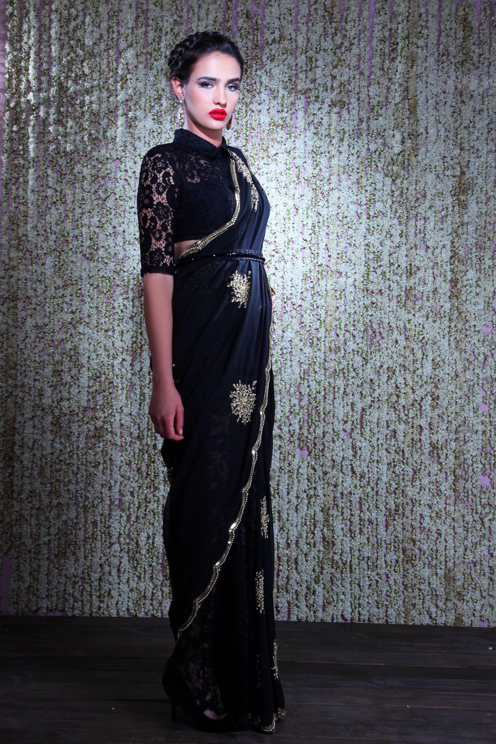 Photo of Black saree with net blouse and silver motifs