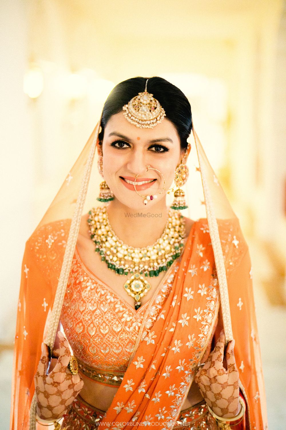 Photo of Stunning bridal portrait with emerald jewellery and gotapatti lehenga