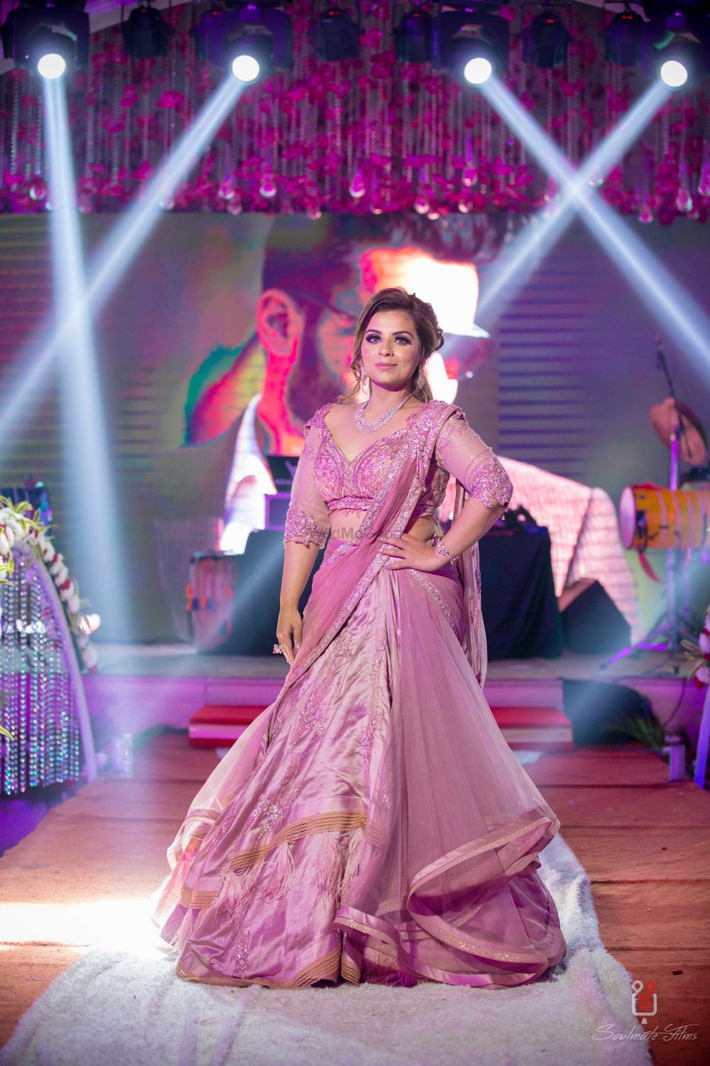 Photo of Sangeet lehenga in onion pink colour with draped silhouette