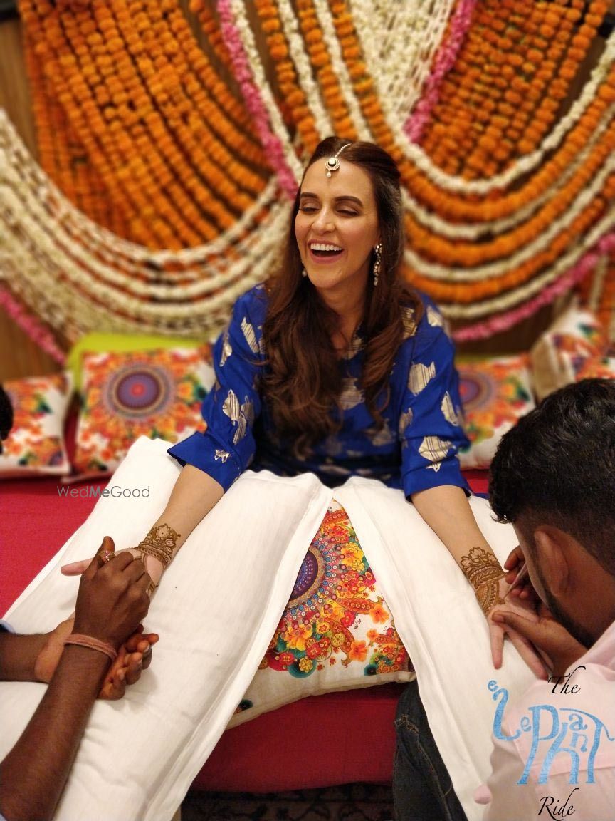 Photo of Neha Dhupia wedding getting mehendi put