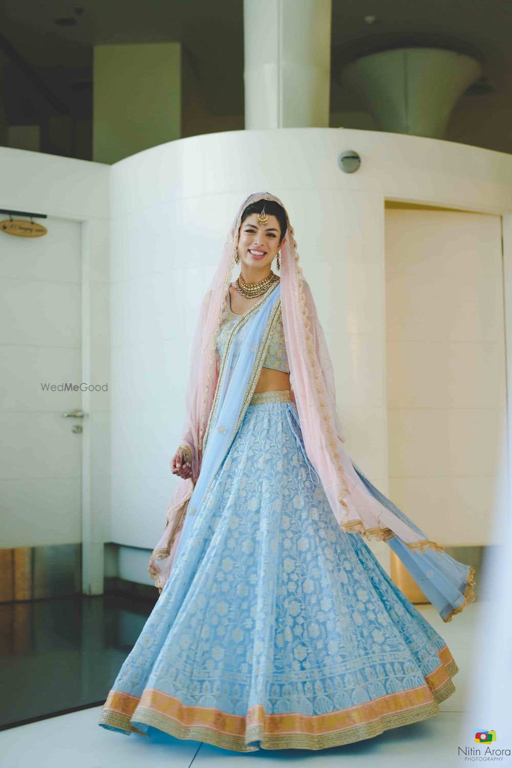 Photo of Light bridal lehenga with light blue and light pink