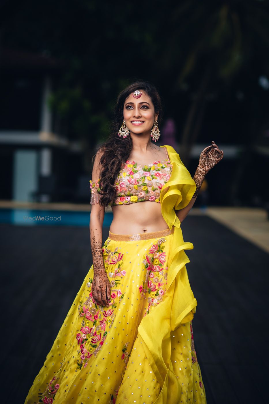 Photo of Ruffled yellow lehenga with floral print for mehendi