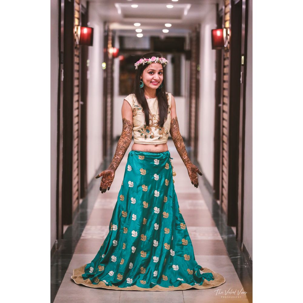 Photo of Bride in turquoise blue mehendi outfit