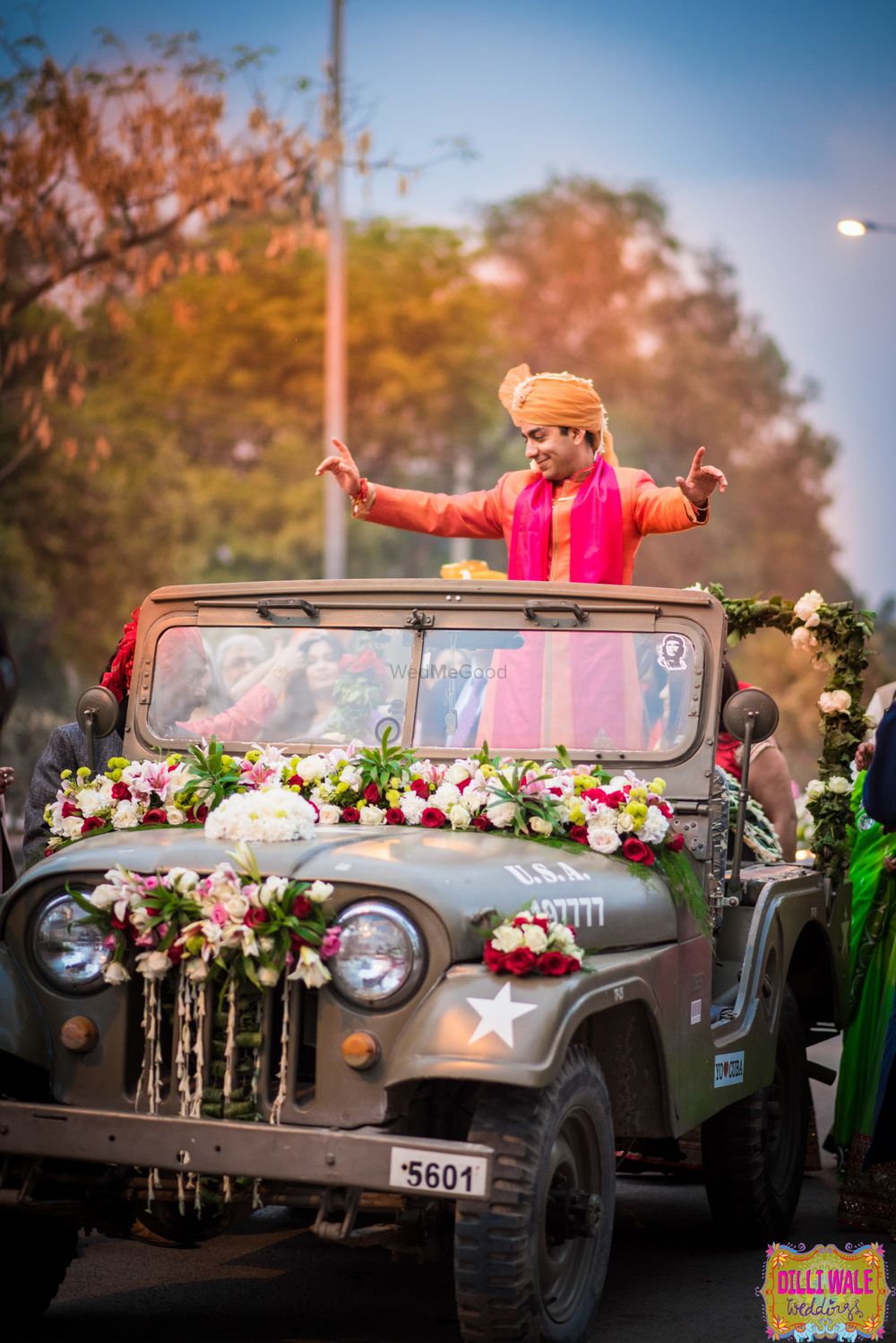 Photo of Groom entering in a jeep