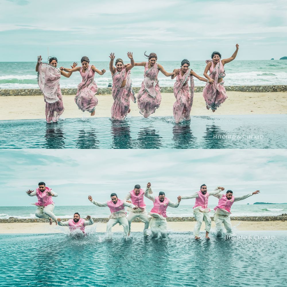 Photo of Matching bridesmaids and groomsmen jumping in water