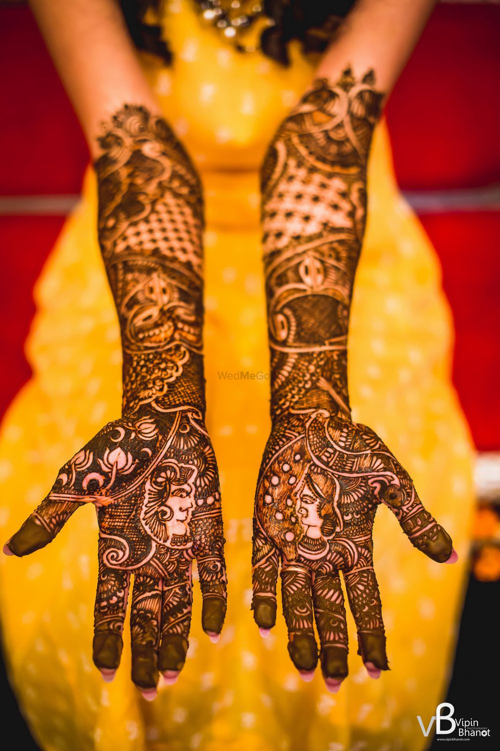 Photo of A girl with mehendi on her arms