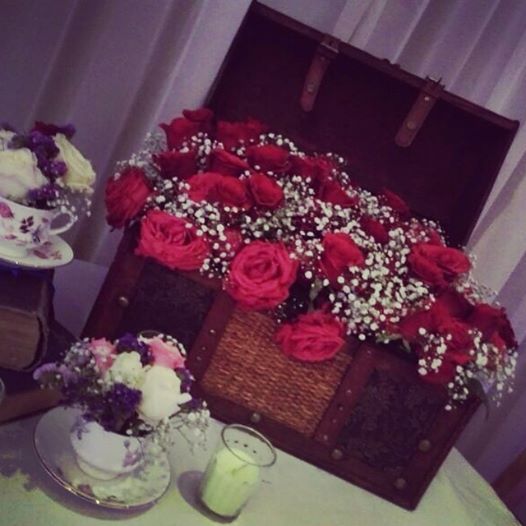 Photo of floral bunches inside wooden trunk