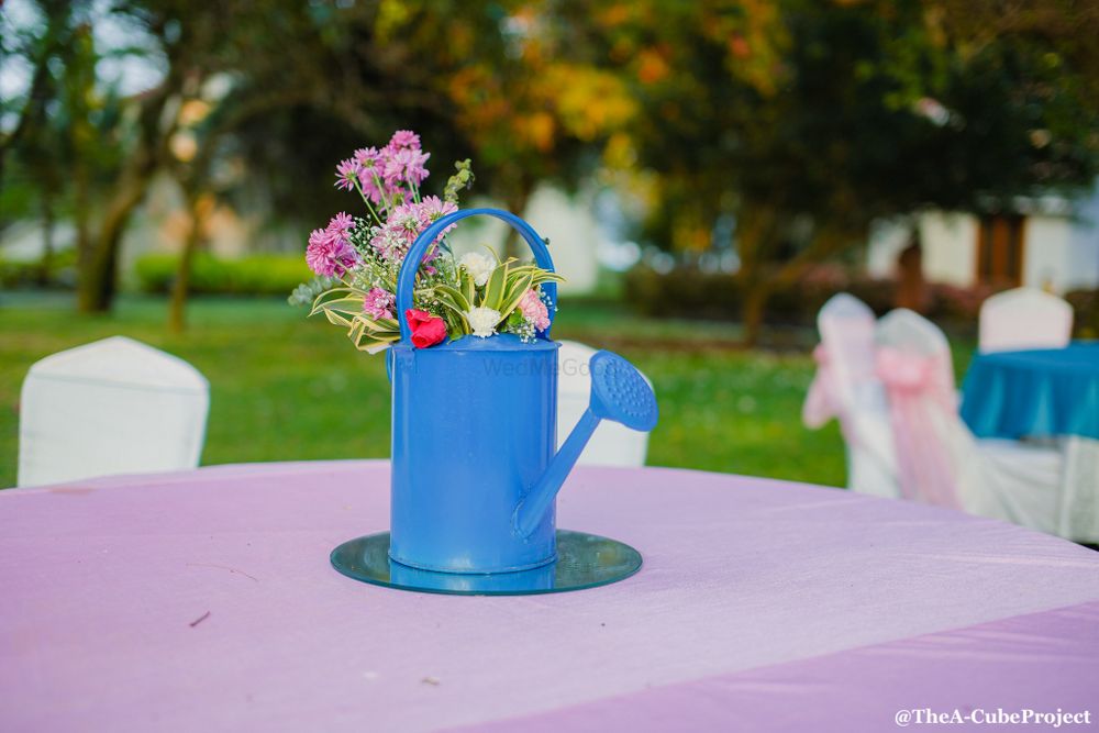 Photo of Mehendi centrepiece idea watering can with flowers