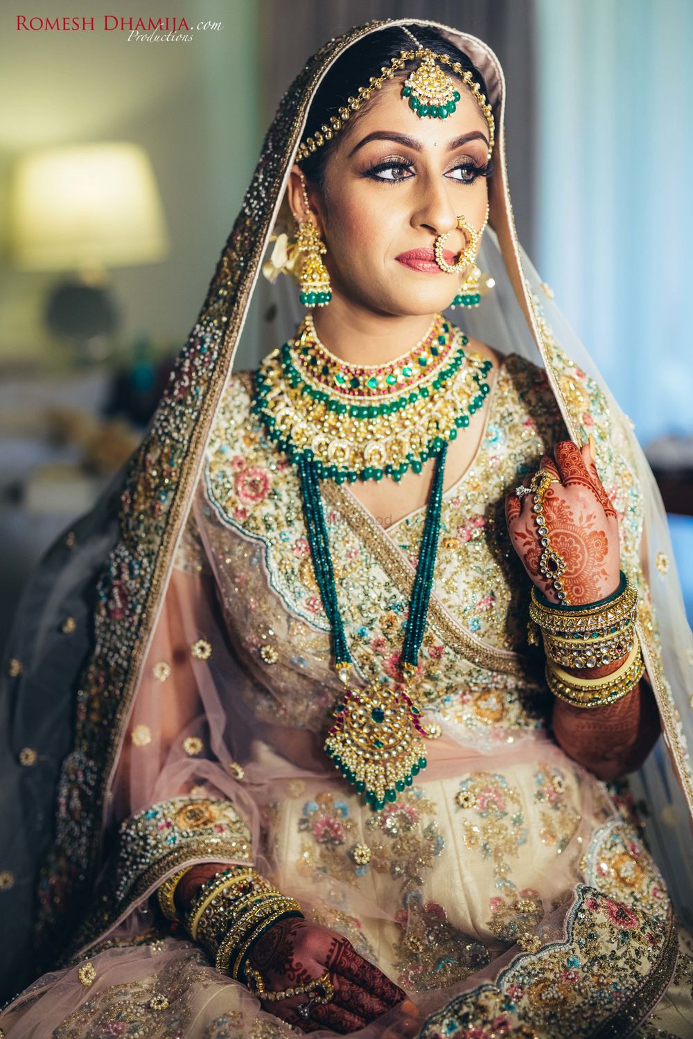 Photo of Sabyasachi bride with layered contrasting jewellery