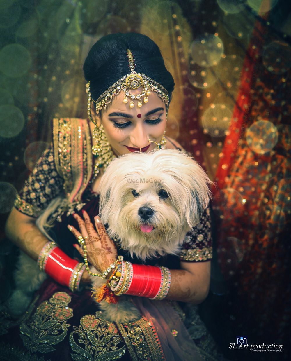 Photo of Bride kissing her pet dog
