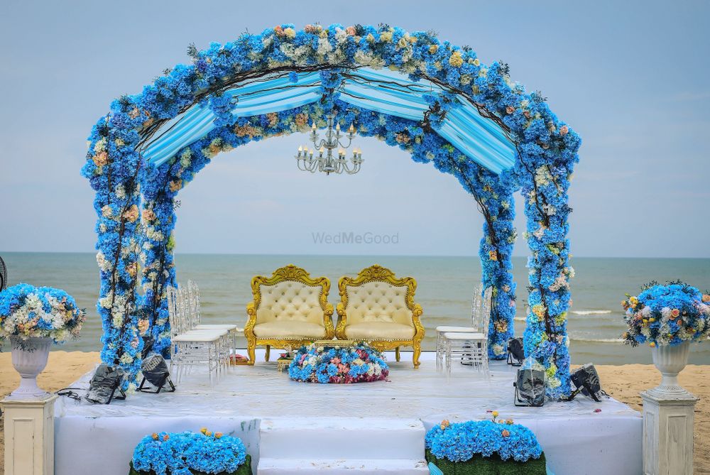 Photo of Blue theme mandap by the beach