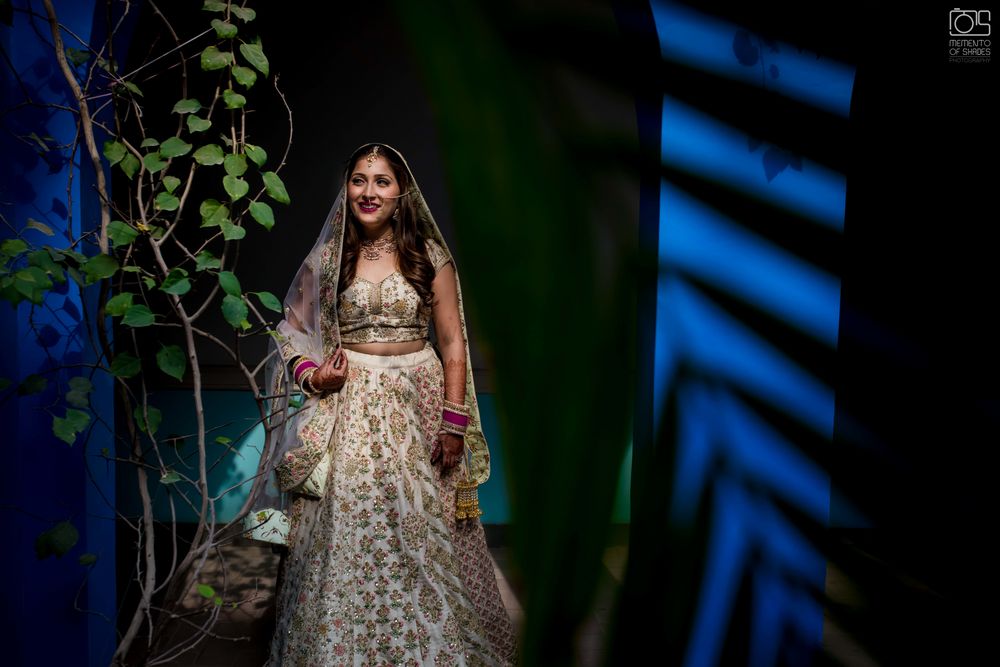 Photo of A bride in an ivory lehenga